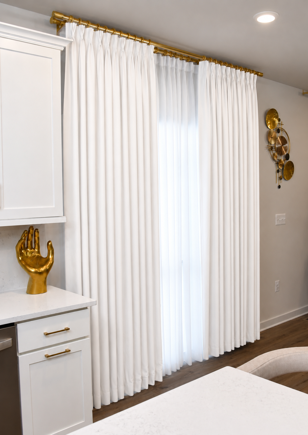 White pinch pleat curtains with gold hardware